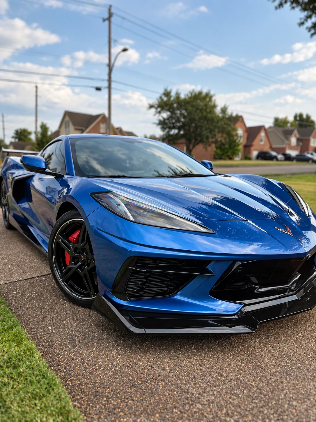 A blue Chevrolet Corvette C8 with a high-gloss ceramic-coated finish