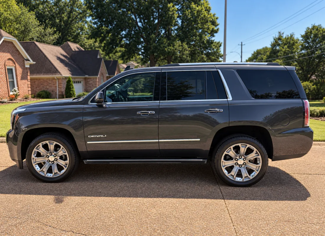 A GMC Yukon Denali detailed to a deep gloss, parked on a driveway in Cordova