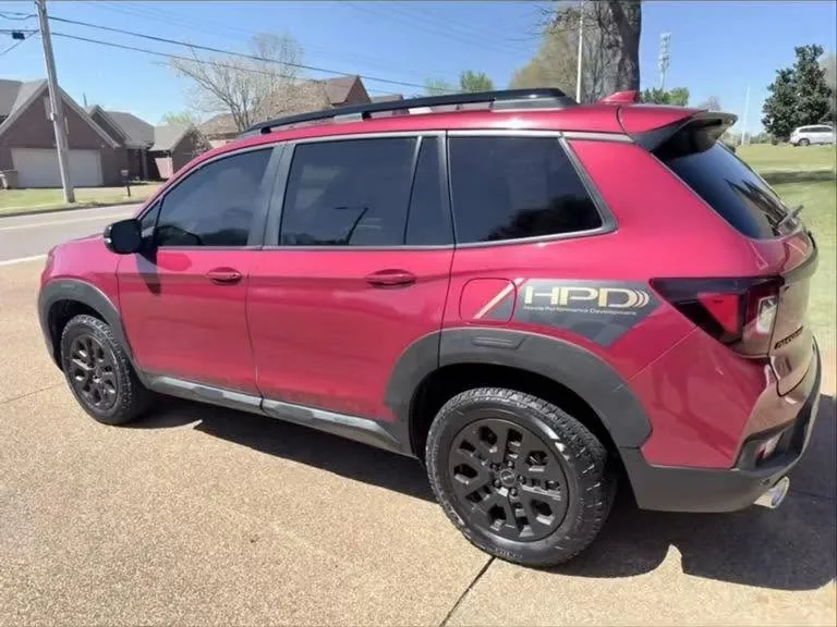 A Honda Passport SUV with a freshly detailed exterior